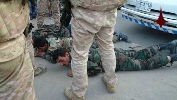 Rus askerleri, rejimin askerlerini göz altina aldi!