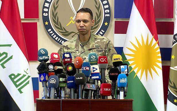 Wezîfa berdevkê koalîsyonê ya albay Myles Caggins bi dawî hat