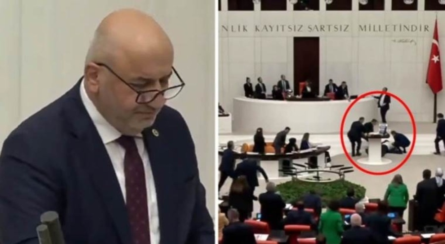 Parlementerê ku li ser kursiyê meclisê diaxifî ji nîska de li erdê ket